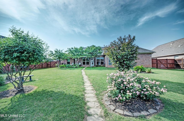 view of yard featuring a fenced backyard