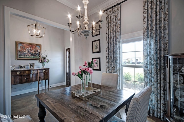 dining area with baseboards, an inviting chandelier, ornamental molding, and a towering ceiling