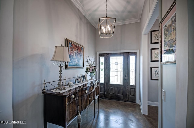 entryway with crown molding, baseboards, concrete floors, and a notable chandelier