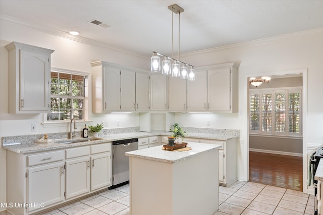 kitchen with sink, a kitchen island, white cabinetry, stainless steel dishwasher, and light tile patterned floors