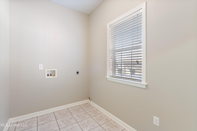 clothes washing area featuring hookup for an electric dryer, hookup for a washing machine, and light tile patterned floors