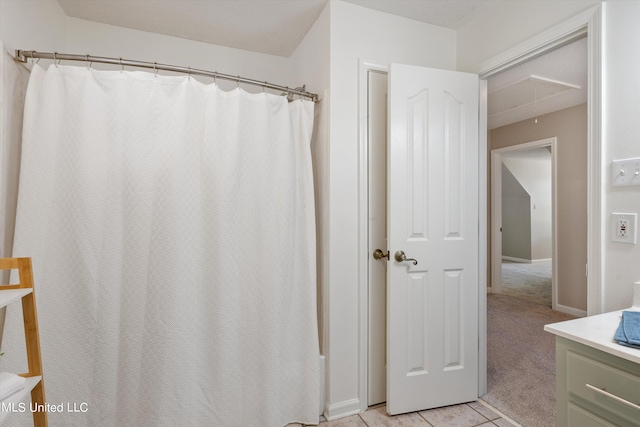 bathroom with vanity and tile patterned flooring