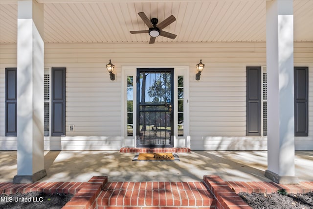 doorway to property with covered porch and ceiling fan