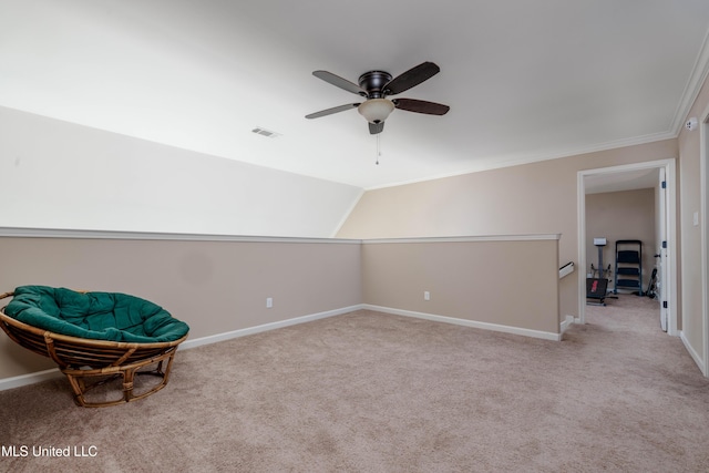 living area with ceiling fan, light colored carpet, vaulted ceiling, and ornamental molding