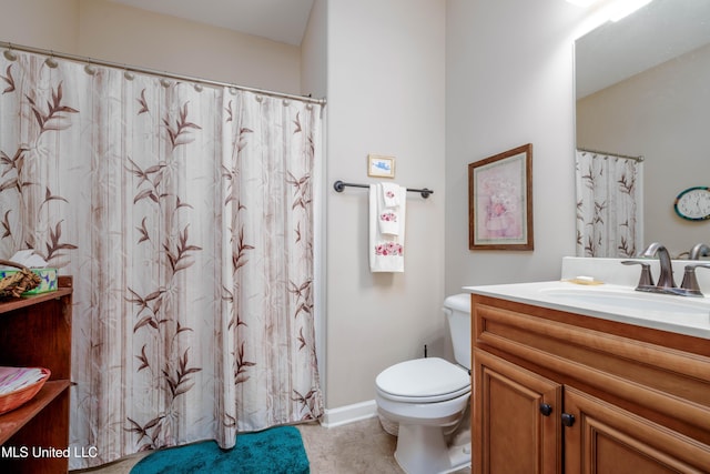 bathroom with toilet and vanity