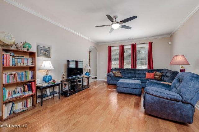 living room with ceiling fan, crown molding, and light hardwood / wood-style flooring