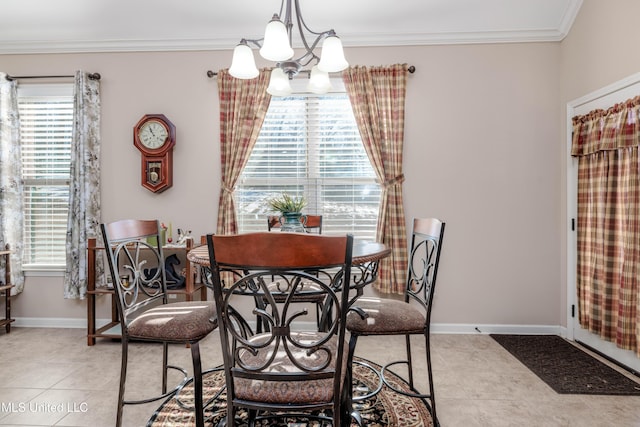 dining room featuring light tile patterned floors, a notable chandelier, plenty of natural light, and ornamental molding