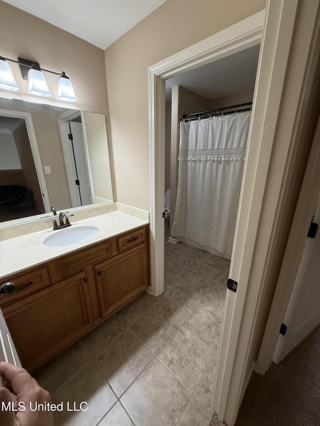 7419 Rose Garden Ln, Olive Branch, MS 38654 - bathroom featuring vanity, tile patterned floors, and a shower with shower curtain