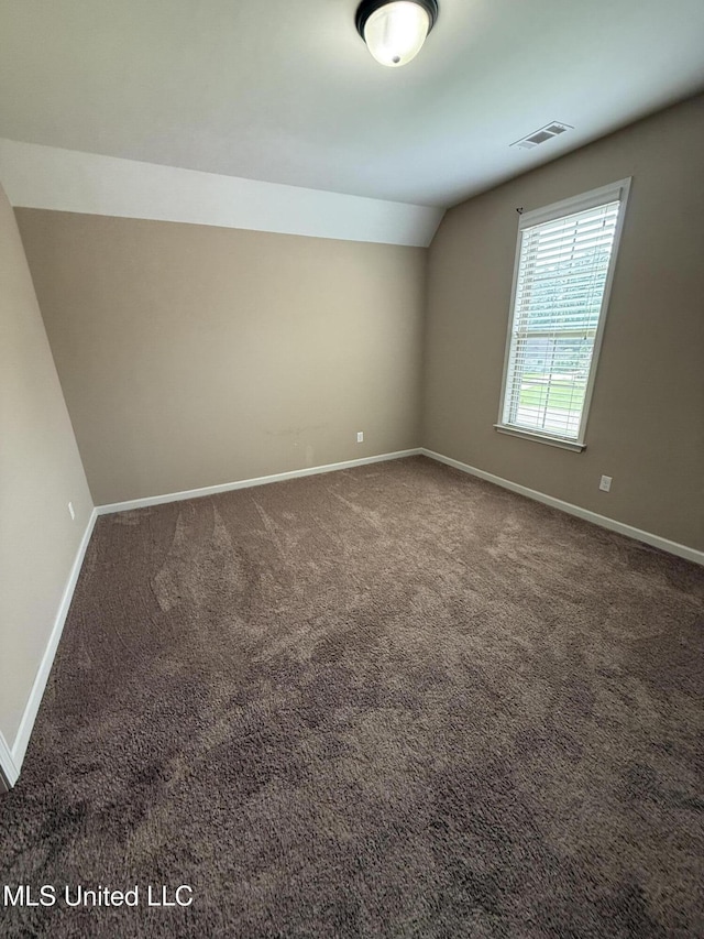 7419 Rose Garden Ln, Olive Branch, MS 38654 - unfurnished room with baseboards, carpet floors, and lofted ceiling