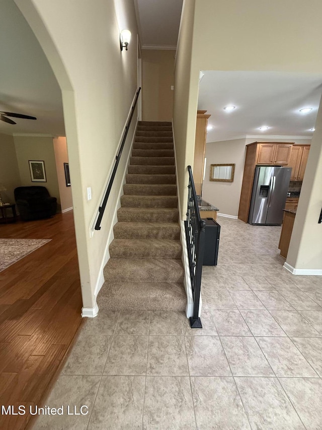 7419 Rose Garden Ln, Olive Branch, MS 38654 - stairway with crown molding, a ceiling fan, arched walkways, recessed lighting, and baseboards