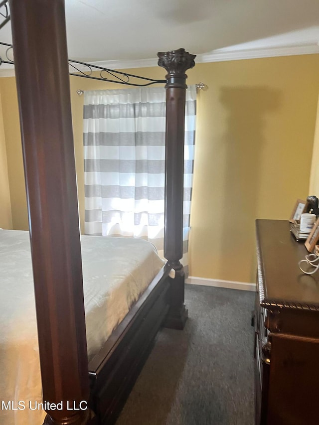 carpeted bedroom featuring ornamental molding