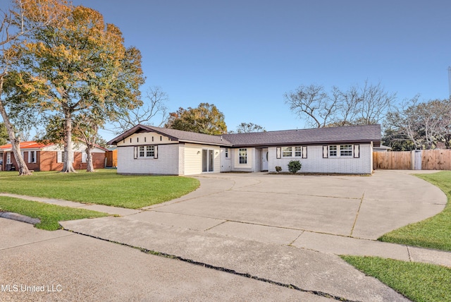 ranch-style house with a front lawn