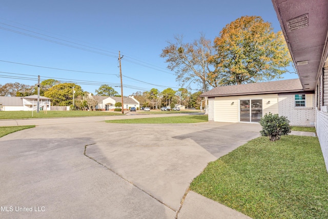 exterior space with a front lawn