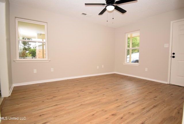 empty room featuring light hardwood / wood-style floors and ceiling fan