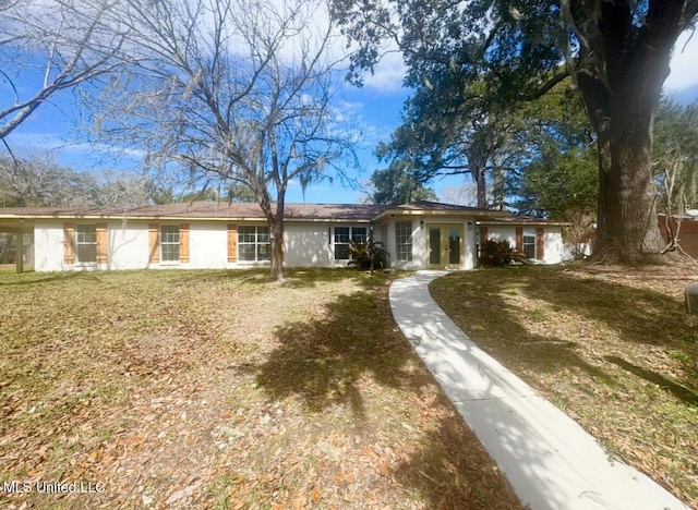 single story home featuring a front yard