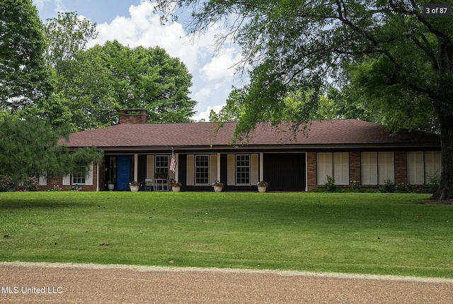 305 Dettor St, Batesville, MS 38606 - single story home with a front lawn, a chimney, and a porch