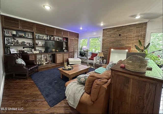 305 Dettor St, Batesville, MS 38606 - living area with a brick fireplace, wood finished floors, ornamental molding, and healthy amount of natural light
