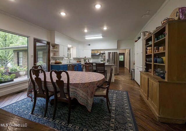 305 Dettor St, Batesville, MS 38606 - dining space with ornamental molding, dark wood finished floors, and recessed lighting