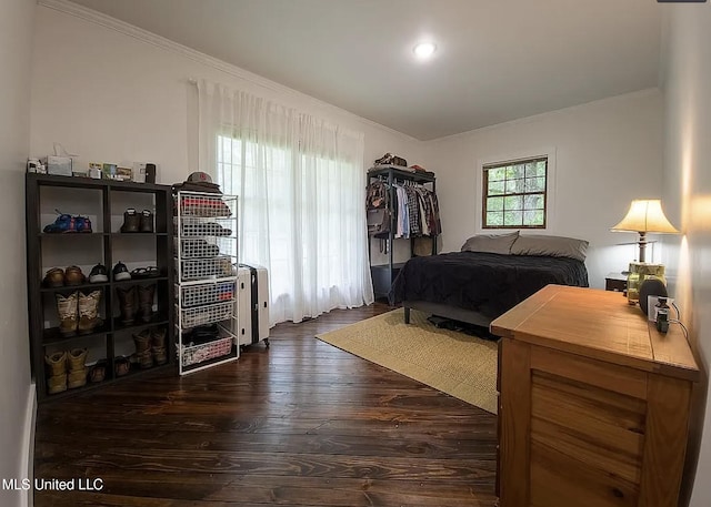 305 Dettor St, Batesville, MS 38606 - bedroom featuring ornamental molding and dark wood-style flooring