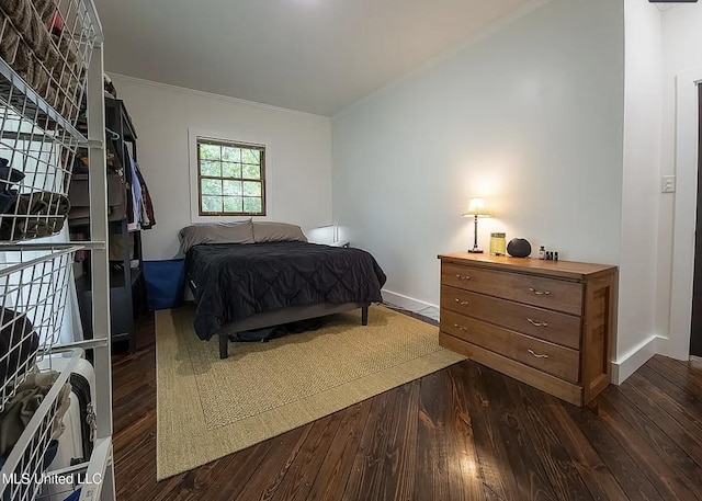 305 Dettor St, Batesville, MS 38606 - bedroom with dark wood-style flooring, crown molding, and baseboards