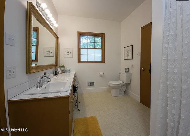 305 Dettor St, Batesville, MS 38606 - bathroom with vanity, toilet, and baseboards