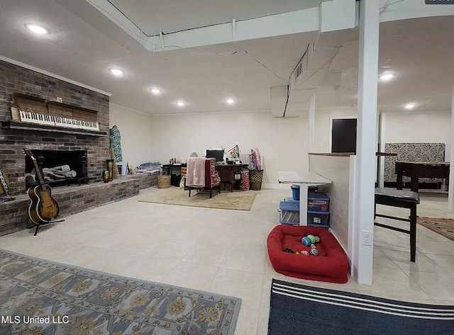 305 Dettor St, Batesville, MS 38606 - tiled living area featuring a brick fireplace and recessed lighting