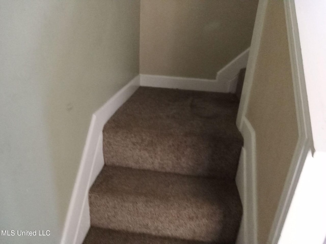 9219 Anding Oil City Rd, Bentonia, MS 39040 - stairs with carpet and baseboards