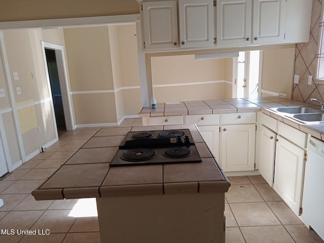 9219 Anding Oil City Rd, Bentonia, MS 39040 - kitchen with tile countertops, light tile patterned flooring, white dishwasher, a sink, and black electric cooktop