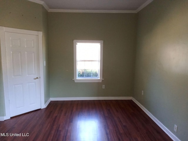 9219 Anding Oil City Rd, Bentonia, MS 39040 - empty room featuring dark wood-style floors, baseboards, and ornamental molding