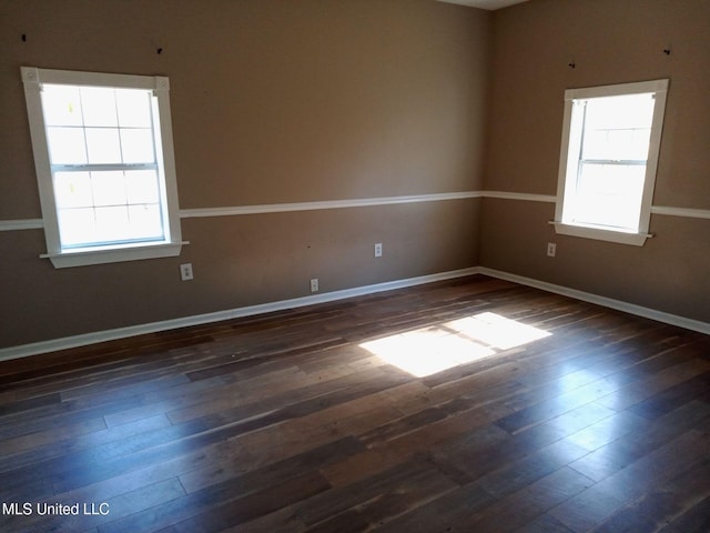 9219 Anding Oil City Rd, Bentonia, MS 39040 - unfurnished room with a wealth of natural light, dark wood finished floors, and baseboards