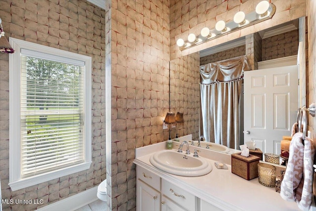 bathroom with vanity, walk in shower, toilet, and tile patterned flooring