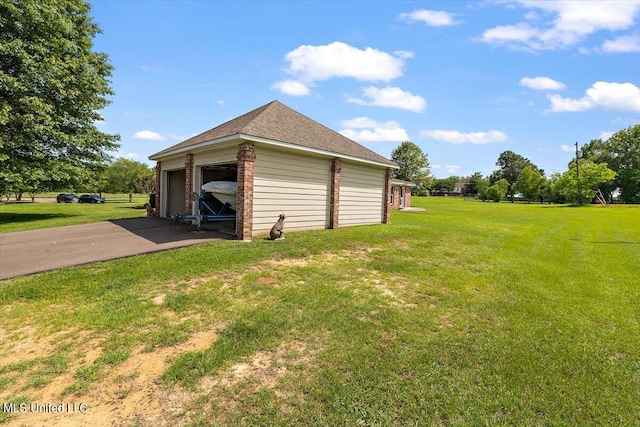 garage featuring a yard