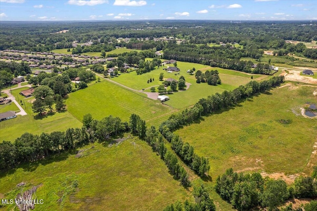 birds eye view of property with a rural view