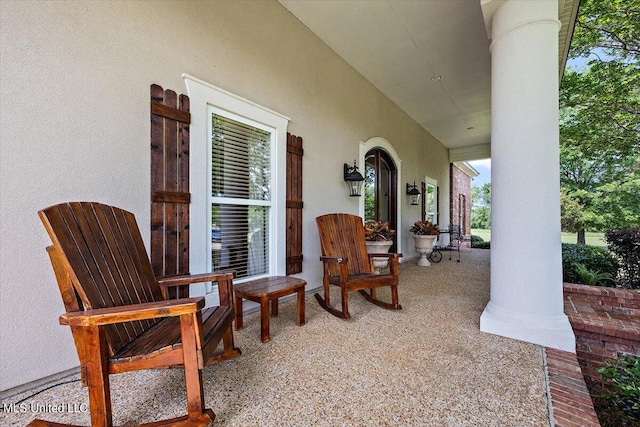 view of patio featuring a porch