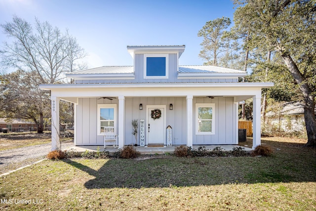 view of front of home with covered porch and a front yard