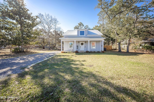 view of front of home with a porch and a front yard