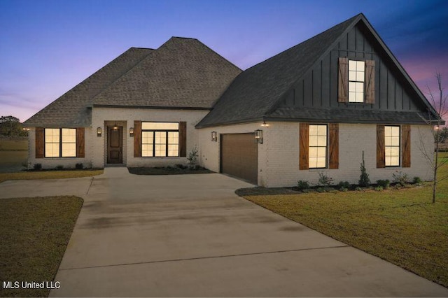 620 Old Savannah Dr, Long Beach, MS 39560 - view of front of house with board and batten siding, an attached garage, concrete driveway, and brick siding