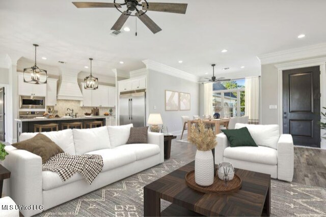 620 Old Savannah Dr, Long Beach, MS 39560 - living area with ceiling fan, recessed lighting, wood finished floors, ornamental molding, and baseboards
