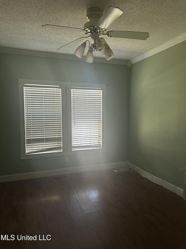 empty room featuring hardwood / wood-style floors, a textured ceiling, ceiling fan, and crown molding