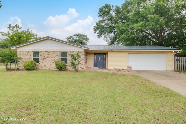 ranch-style home featuring a front yard, driveway, fence, and a garage
