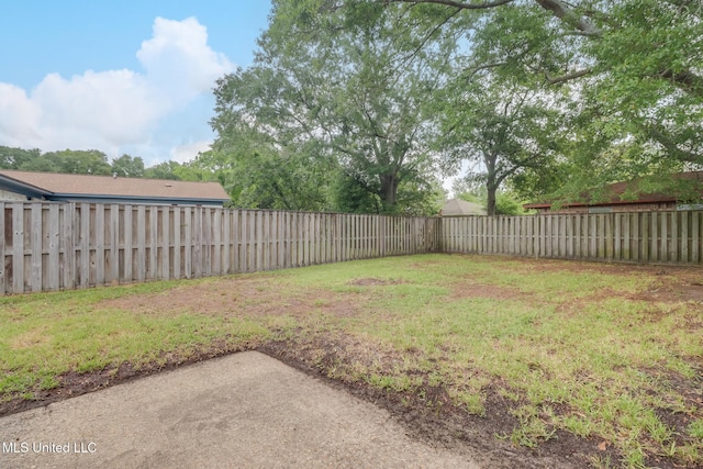 view of yard with a fenced backyard