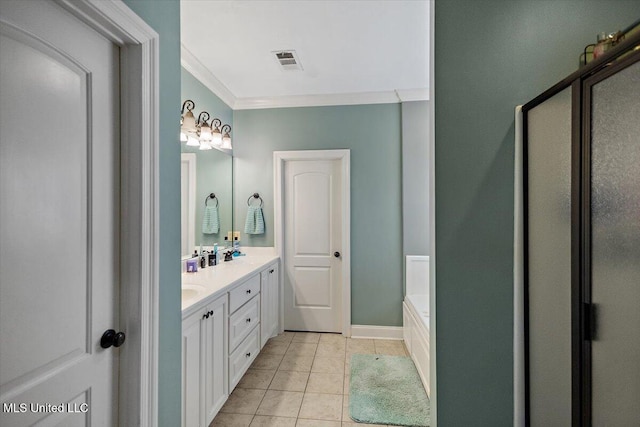 bathroom with tile patterned flooring, crown molding, vanity, and a tub to relax in