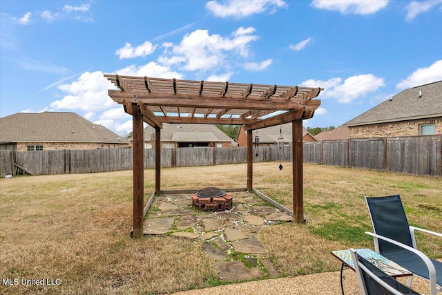 view of yard featuring a pergola, a fire pit, and a patio area