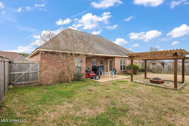 back of property featuring a patio, a pergola, a lawn, and an outdoor fire pit