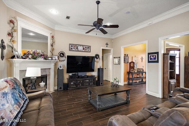 living room featuring ornamental molding and ceiling fan