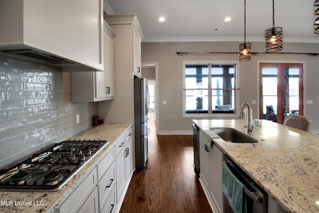 kitchen with light stone countertops, appliances with stainless steel finishes, custom exhaust hood, white cabinets, and dark hardwood / wood-style floors