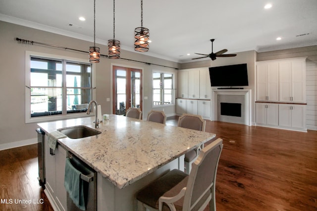 119 Shore View Dr, Madison, MS 39110 - kitchen with a sink, open floor plan, stainless steel dishwasher, a ceiling fan, and a center island with sink