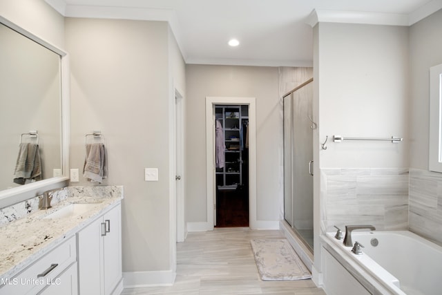 bathroom featuring vanity, independent shower and bath, and ornamental molding