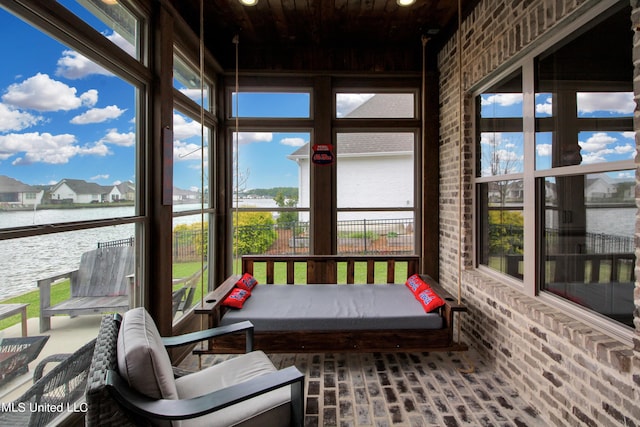 119 Shore View Dr, Madison, MS 39110 - sunroom with brick flooring, a water view, brick wall, and wooden ceiling