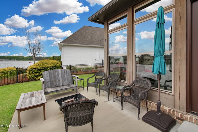 view of patio / terrace featuring a water view